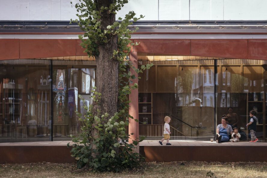 A child walking across a walkway outside the library