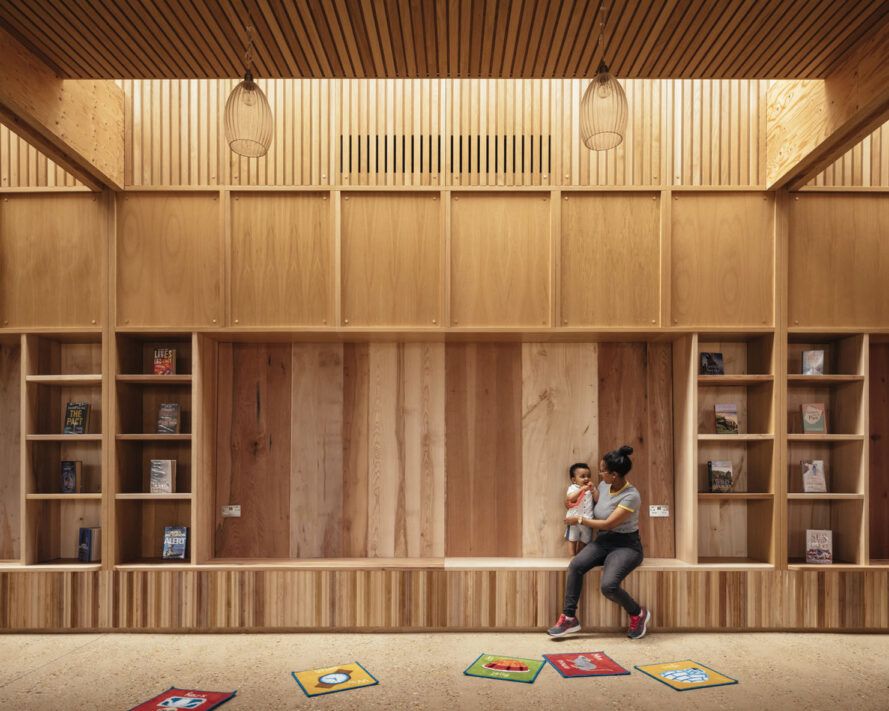 All-wood interior with a child and parent sitting