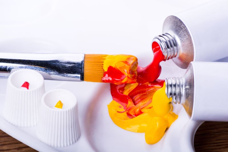 yellow and red artist paint