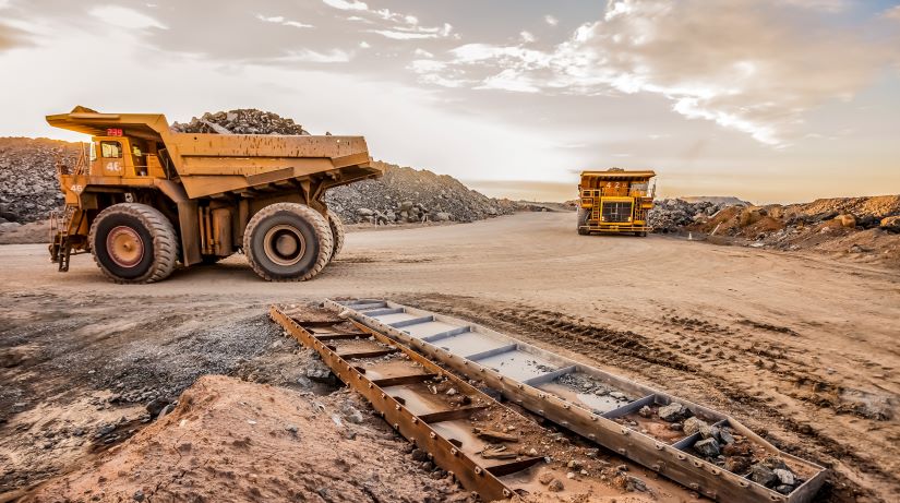 Mining trucks transport platinum for processing