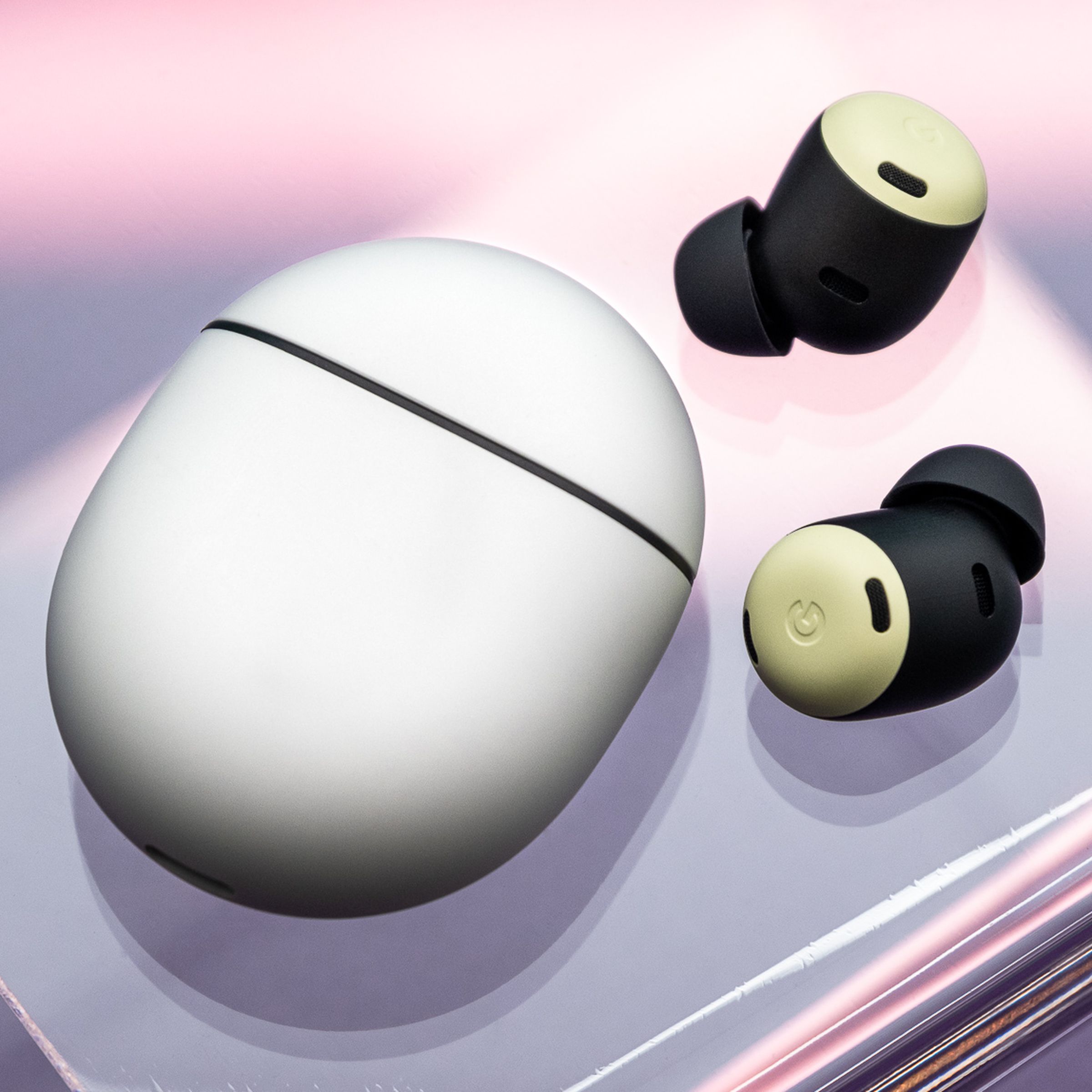 A photo of the Google Pixel Buds Pro on a clear stand with a purple background.