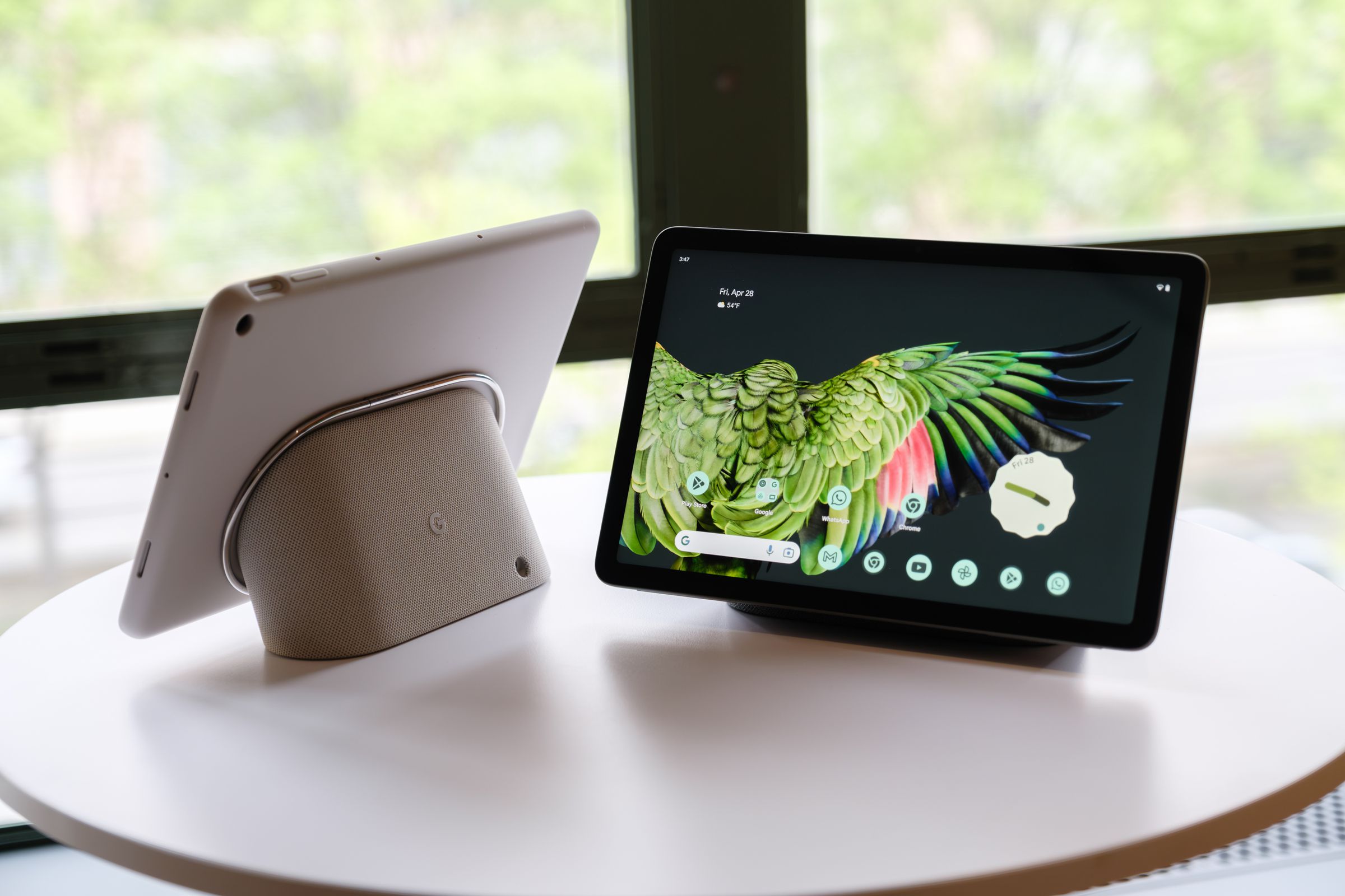 The Pixel Tablet in dark green and off-white.