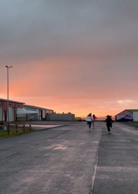 People running toward the sun