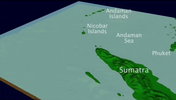 Animation of tsunami waves propagating and moving across the ocean surface and impacting island land masses.